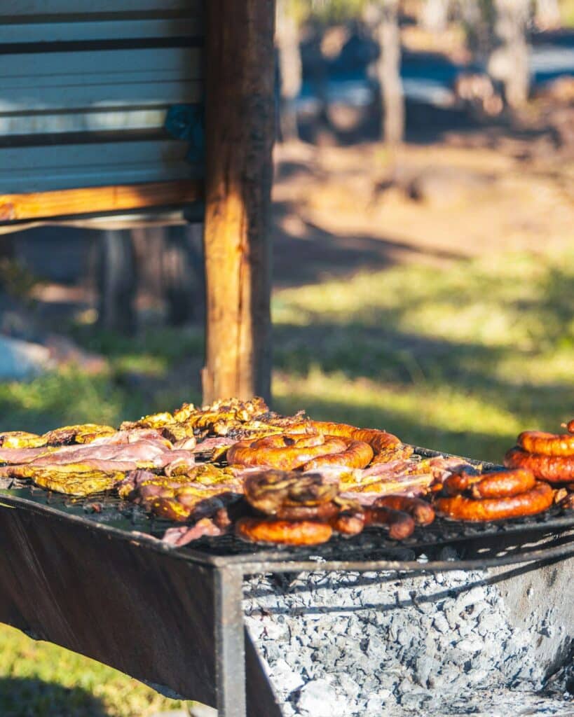 Meat and sausage cooking on a barbecue grill